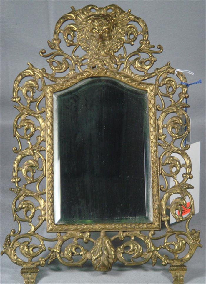 Figural brass bracket mirror/sconce,