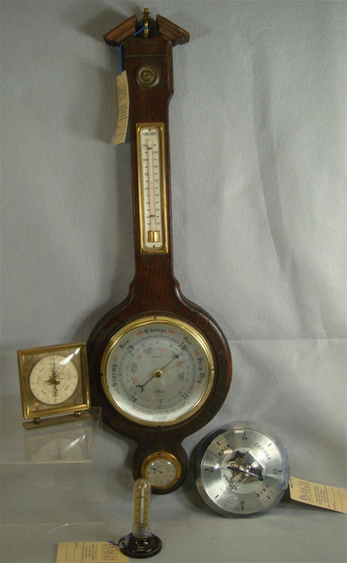2 aneroid barometers, stick thermometer,