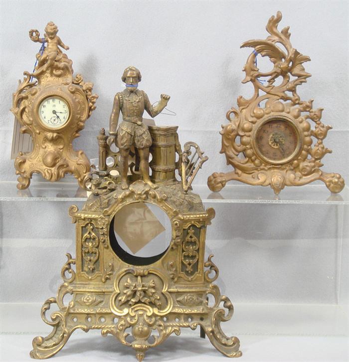 3 cast metal figural clock cases,