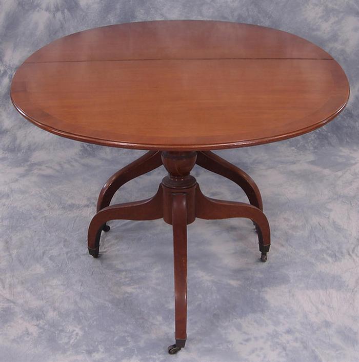 Oval banded mahogany dining room