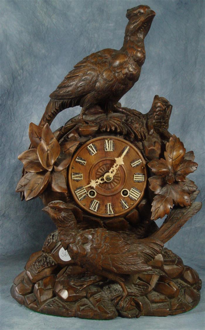 Figural carved Black Forest mantle clock,