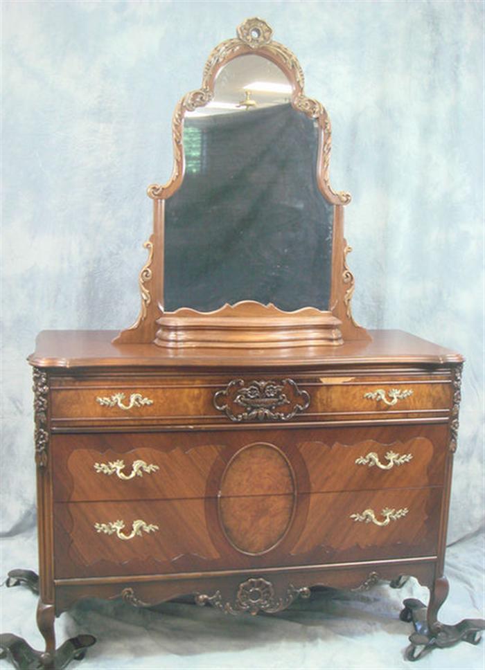 Carved walnut veneered bureau with mirror,