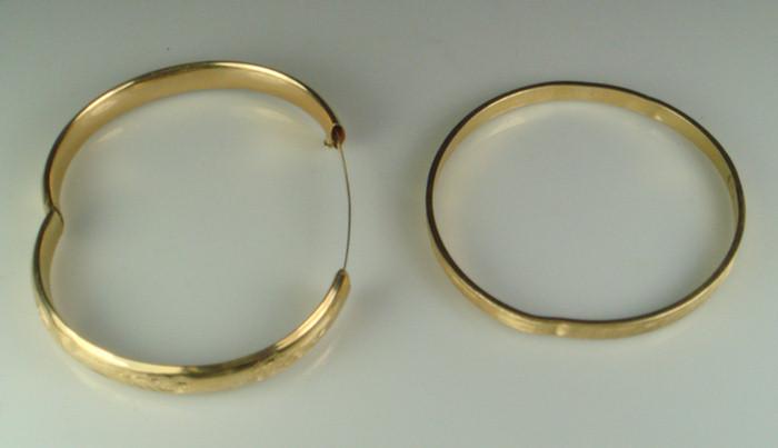 2 14K YG bangles, each with dents,