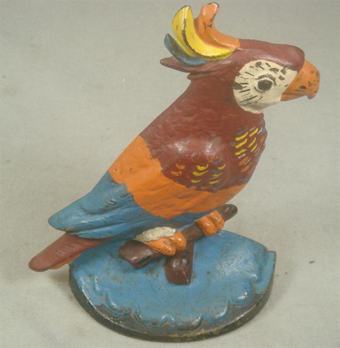 Cast iron doorstop, colorful parrot