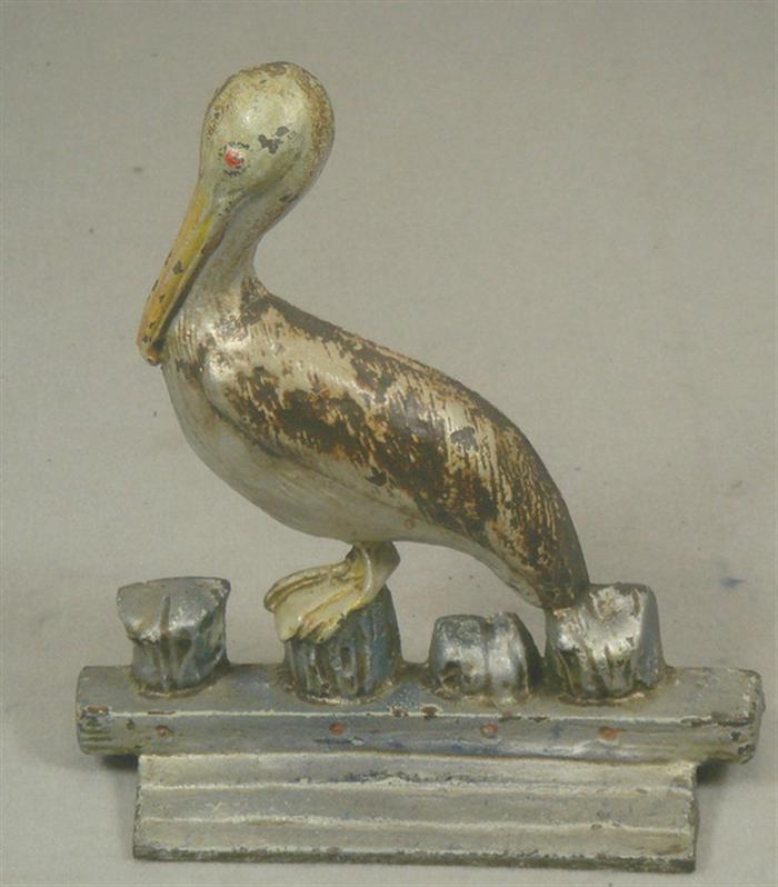 Cast iron doorstop pelican on 3c597