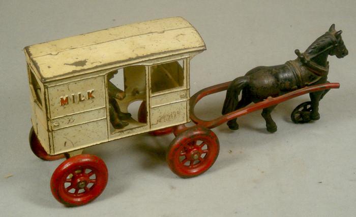 Cast iron toy,  horse drawn milk cart