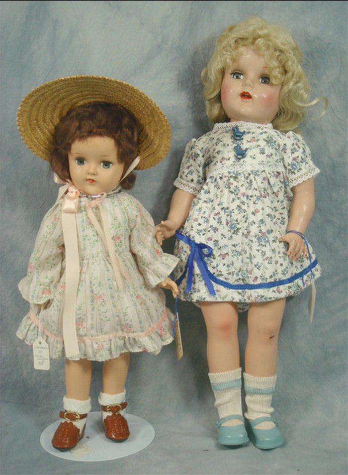 Two hard plastic dolls, both not