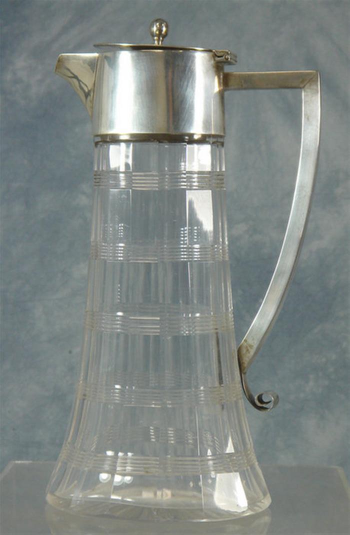 Cut crystal and silver lidded decanter,