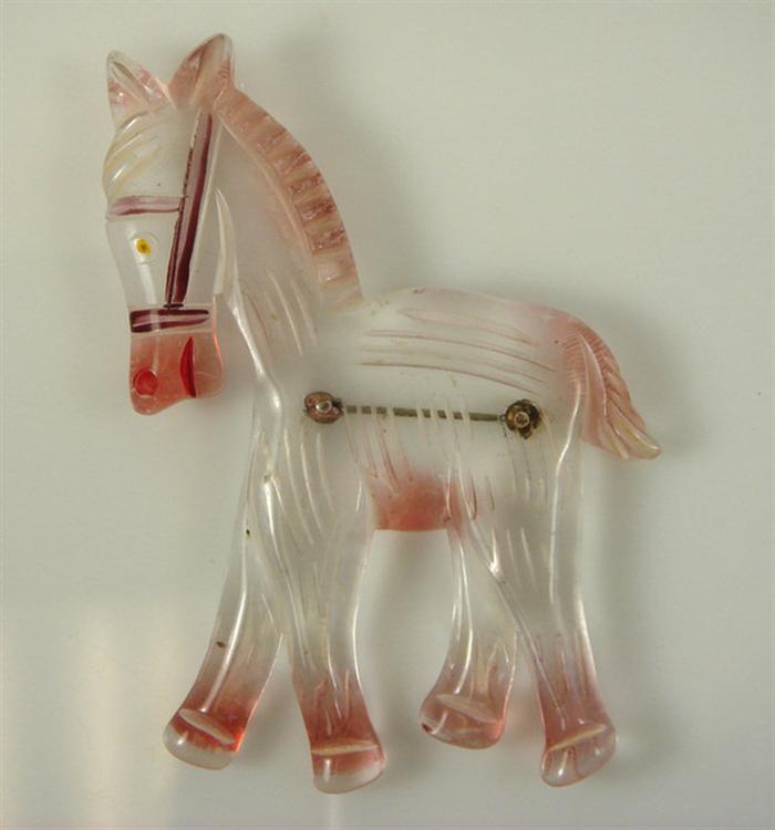 Lucite horse pin, pink tinged color