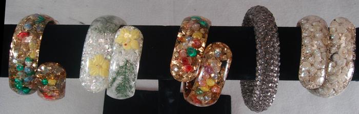 4 hinged costume bracelets, one other