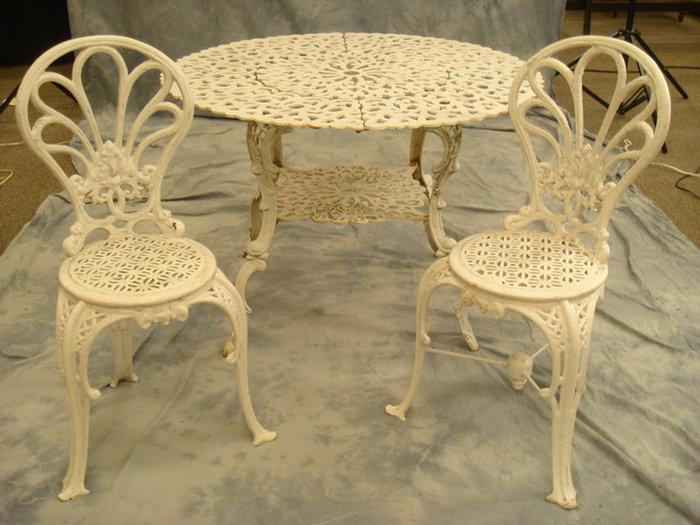 Cast iron patio table with two