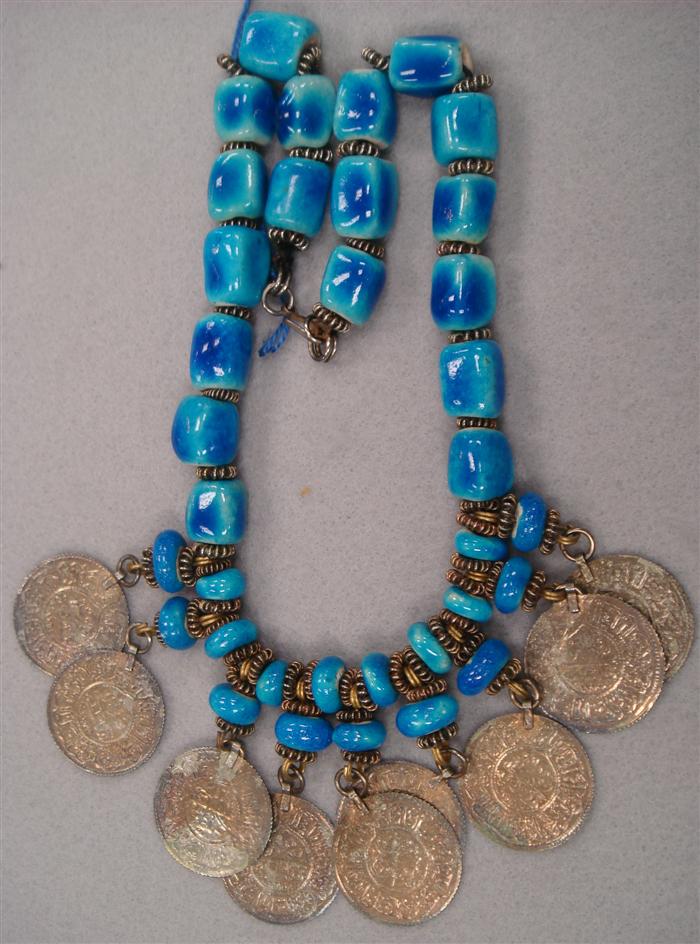 Necklace featuring bright blue glass