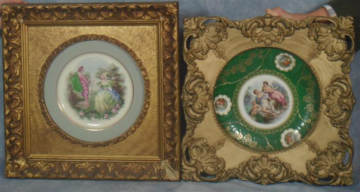 2 of porcelain plates in gold frames,