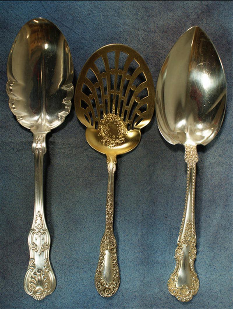 2 sterling silver serving spoons,
