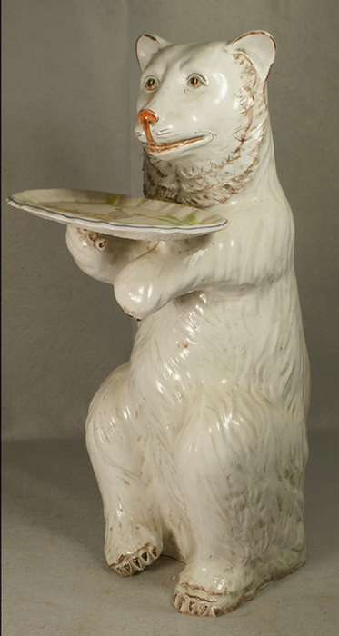 Tin glazed standing bear holding