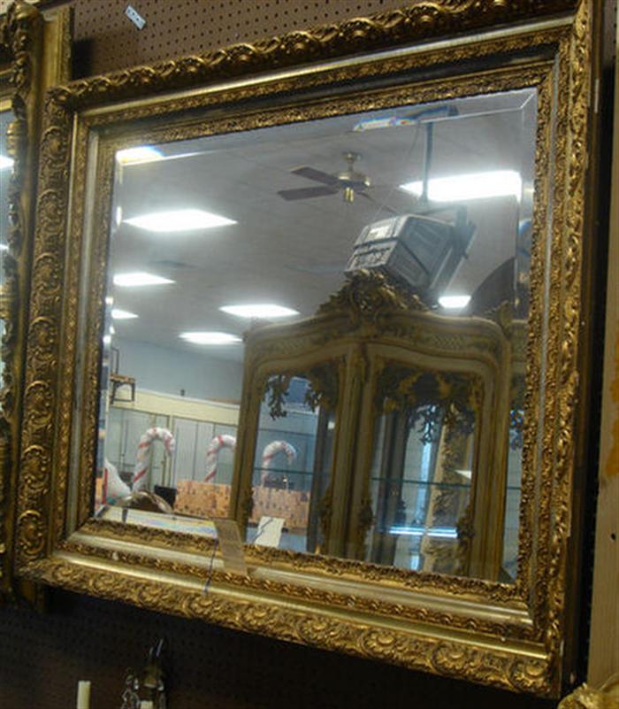 Ornate gilt framed wall mirror