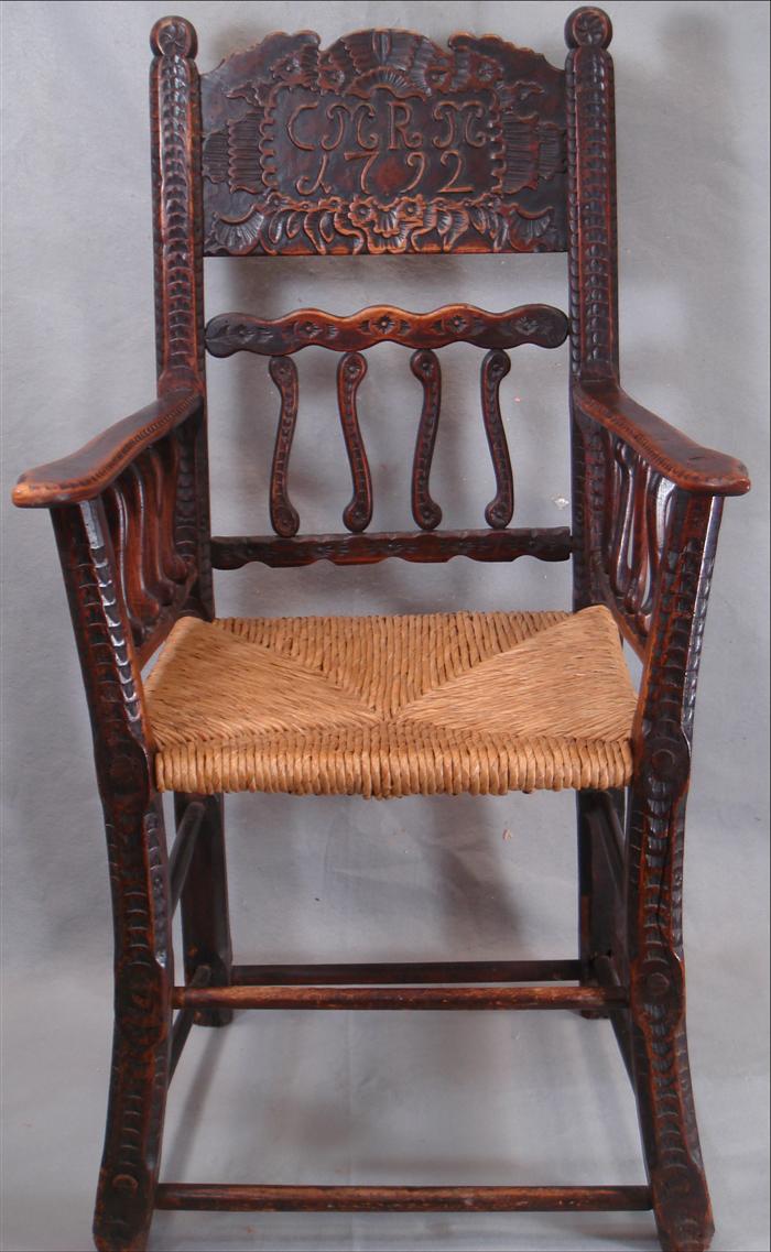 Carved oak English armchair, rustic