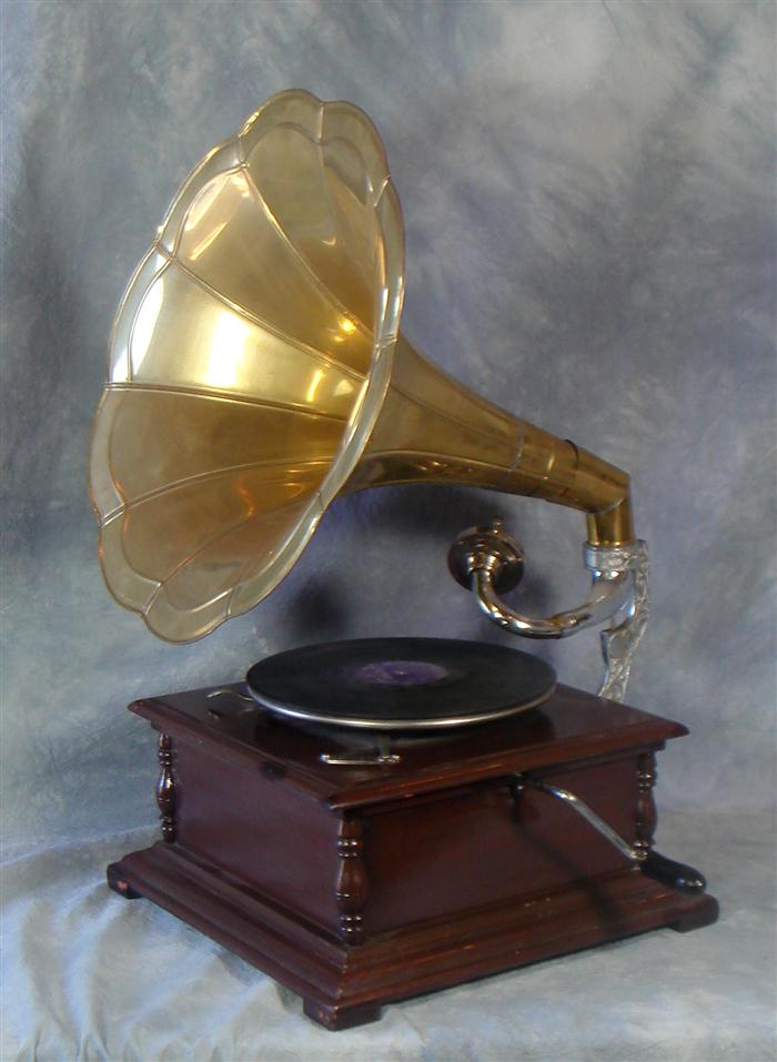 Reproduction victrola with record album,