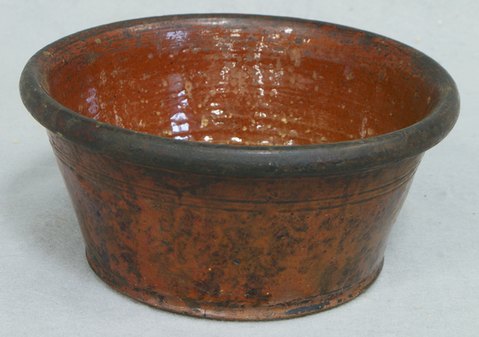 Redware bowl with manganese decoration,