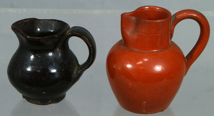  2 miniature glazed redware pitchers  3da63