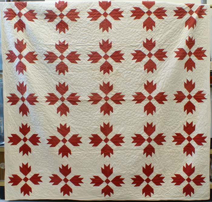 Red & white bear claw pattern quilt,