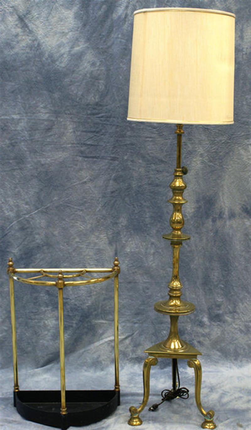 Brass floor lamp with tripod base,