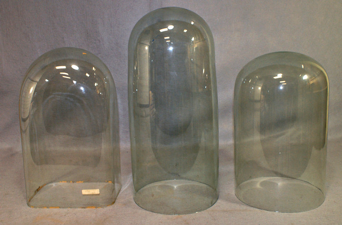 3 blown glass domes, one rectangular,