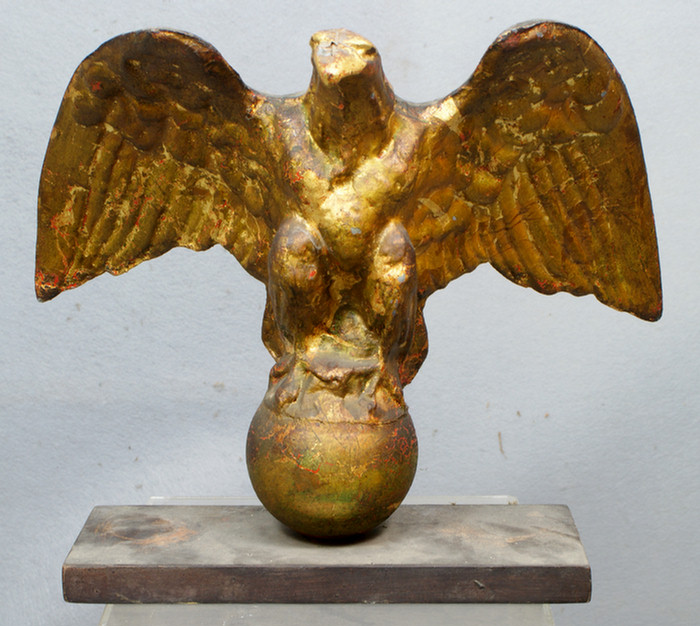 Carved and gilt wood spread winged