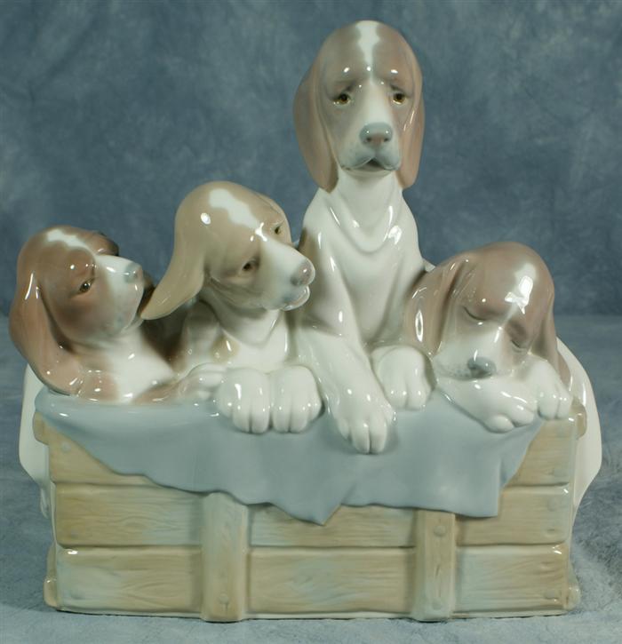 Lladro figurine, four puppies in