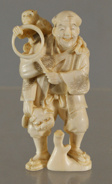 Carved ivory figure of a man with