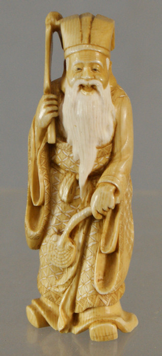 Carved ivory figure of an elder 3dd56