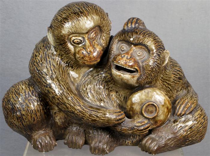 Japanese stoneware carving of two monkeys,