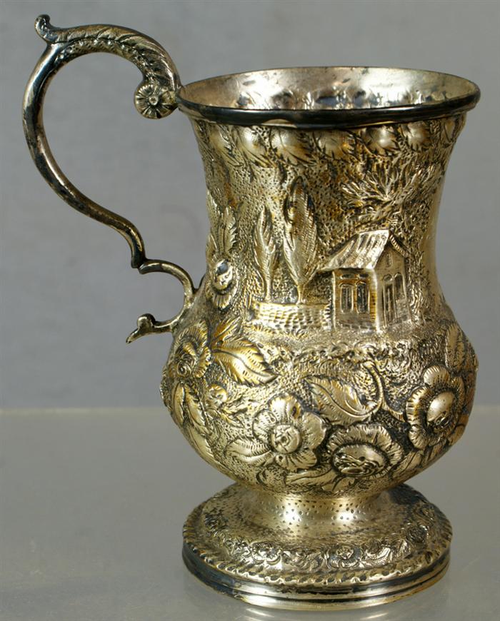 Repousse coin silver mug by Samuel Kirk,