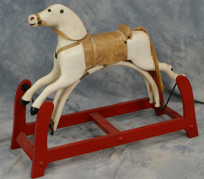 Carved and painted wood gliding horse,