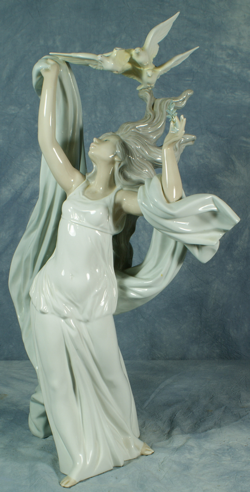 Lladro figurine of a maiden with doves