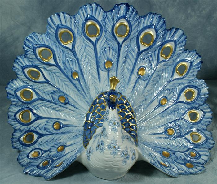 Blue porcelain peacock figurine,