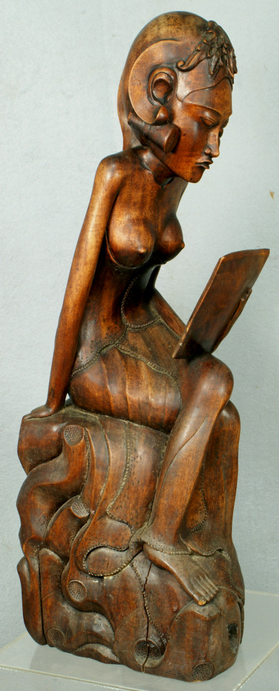 Carved Balinese figure of a nude woman