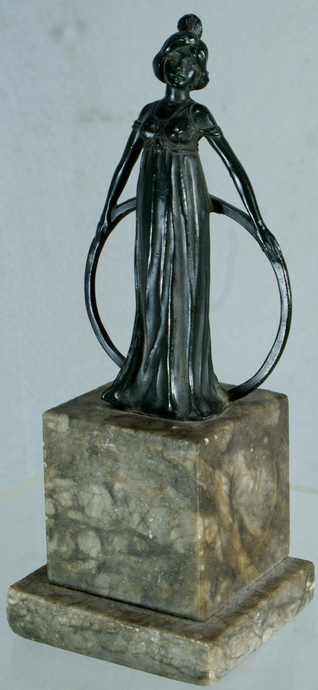 Patinated white metal sculpture