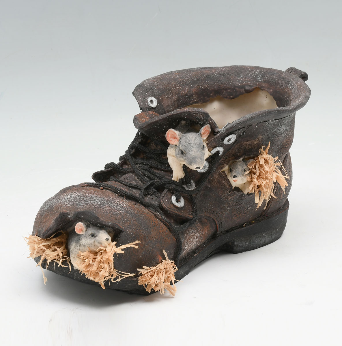 CAST OLD SHOE SCULPTURE WITH MICE IN