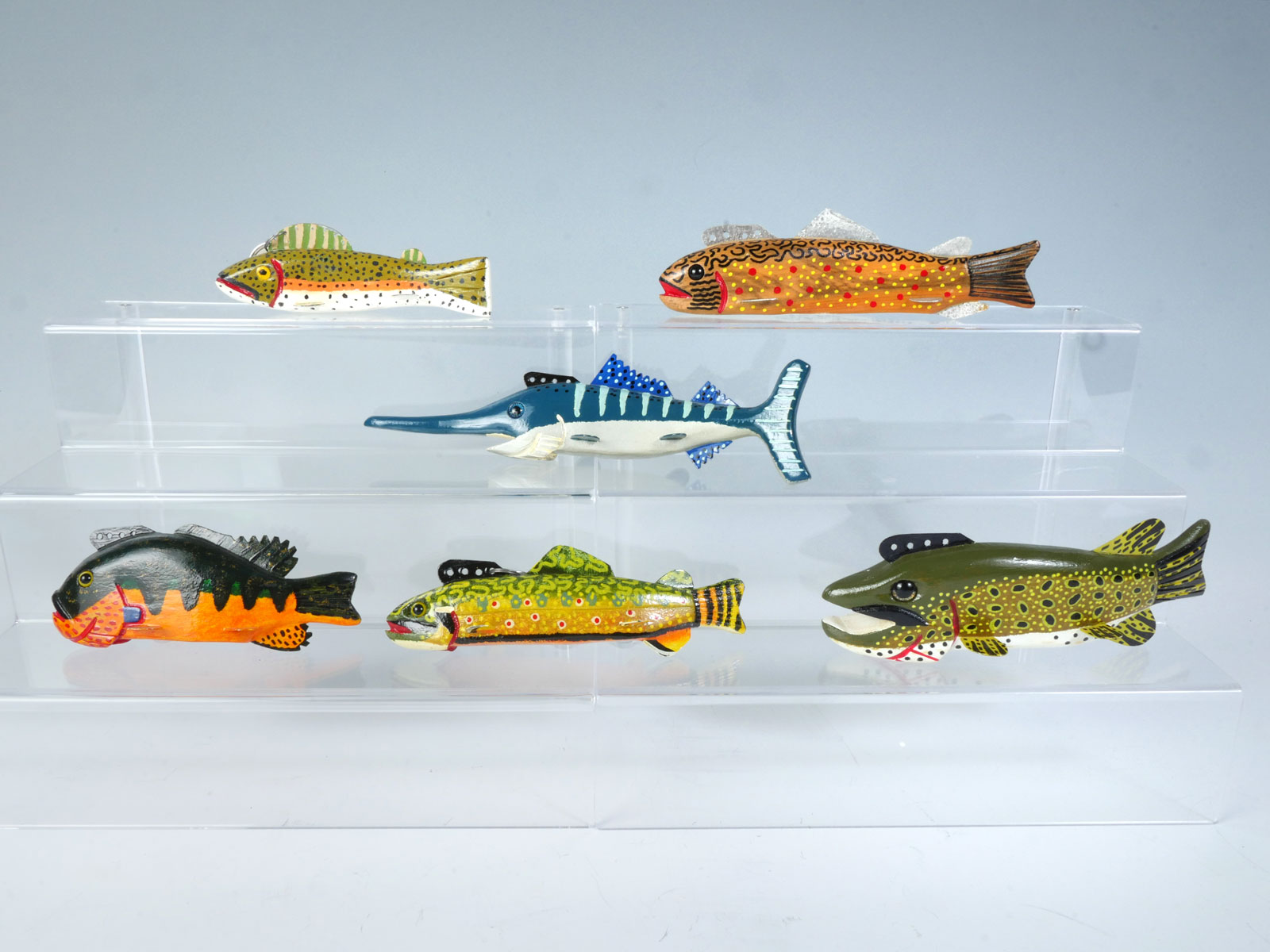 SIX HAND-CARVED AND PAINTED FISH