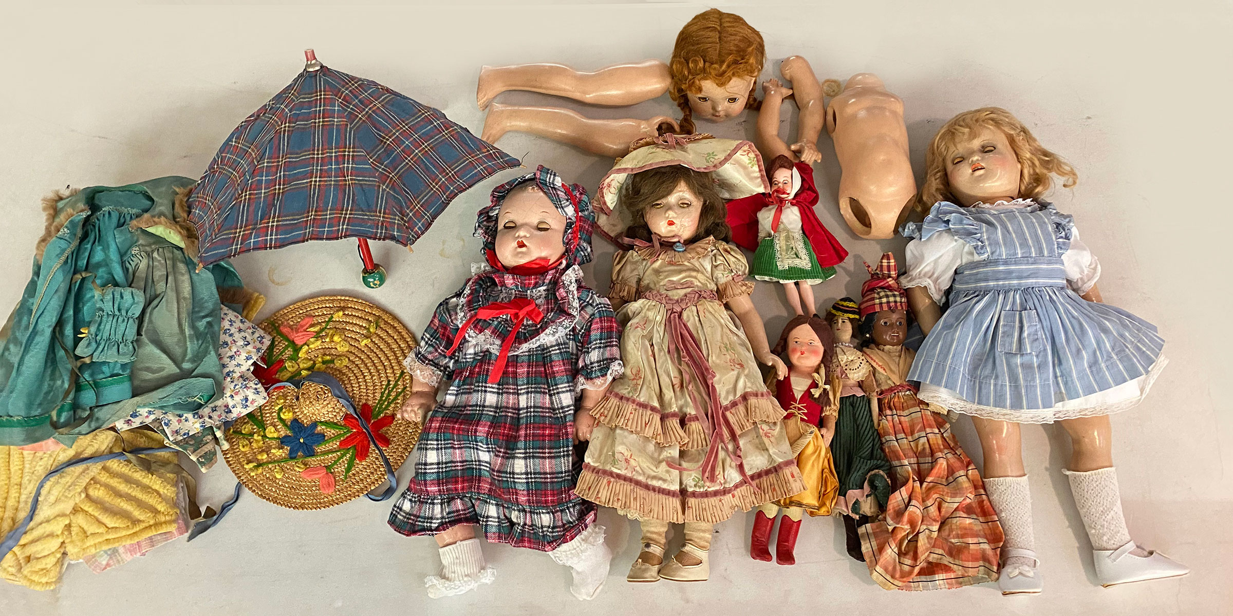 LOT OF ASSORTED OLD DOLLS AND CLOTHES
