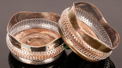 A pair of silver plated wine coasters 2794e1