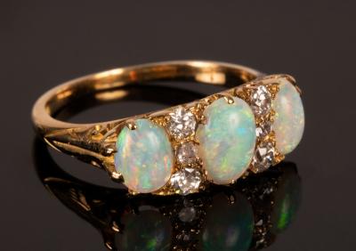 An opal three stone ring the oval 27950d