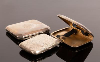 Three silver cigarette cases, various,