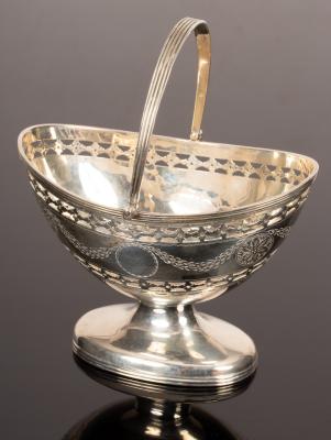 A pierced silver sugar basket,