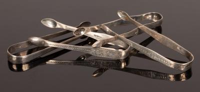 Four pairs of George III silver sugar