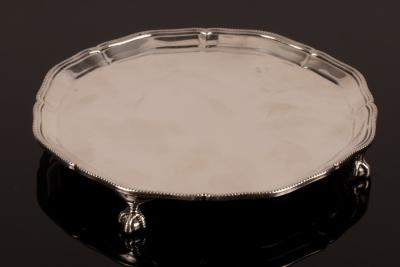A silver salver, retailed by Harrods,