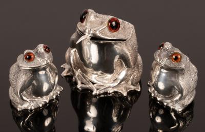 A novelty three-piece silver cruet