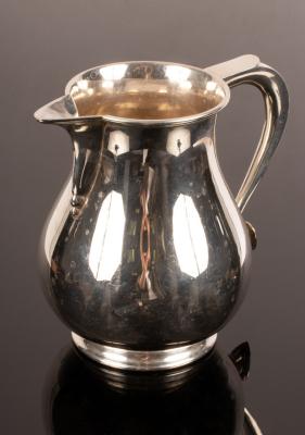 A Georgian style silver beer jug,