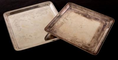 A pair of Continental white metal trays,
